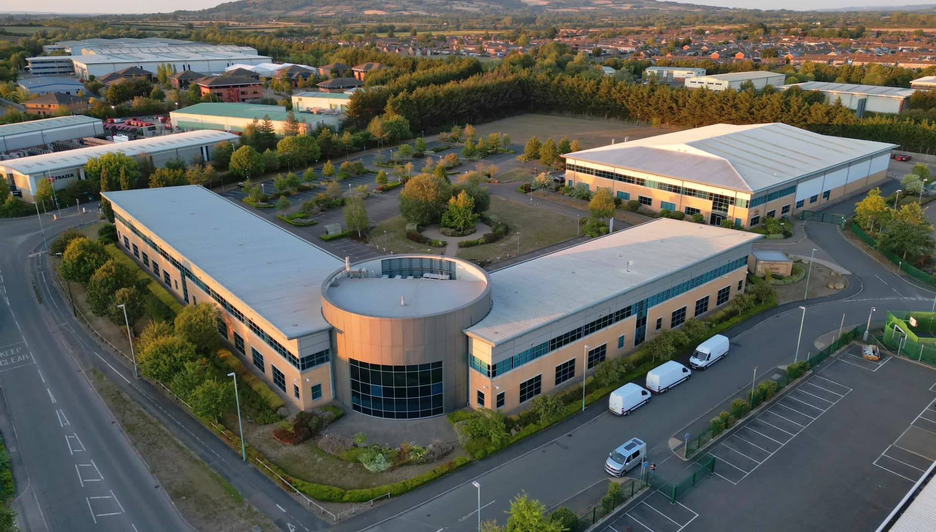 Aerial view of a landscaped business park estate with maintained grounds