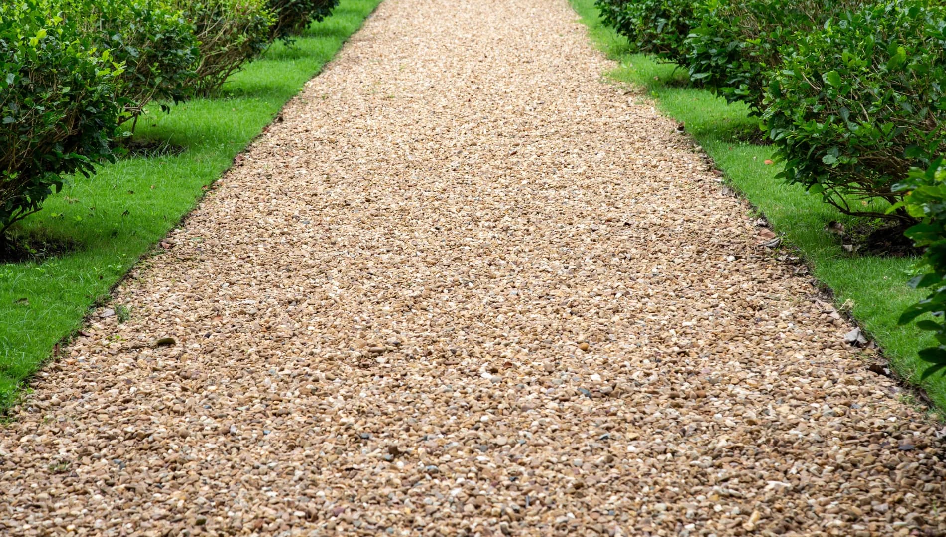 Formal commercial grounds with clipped hedging along a maintained path